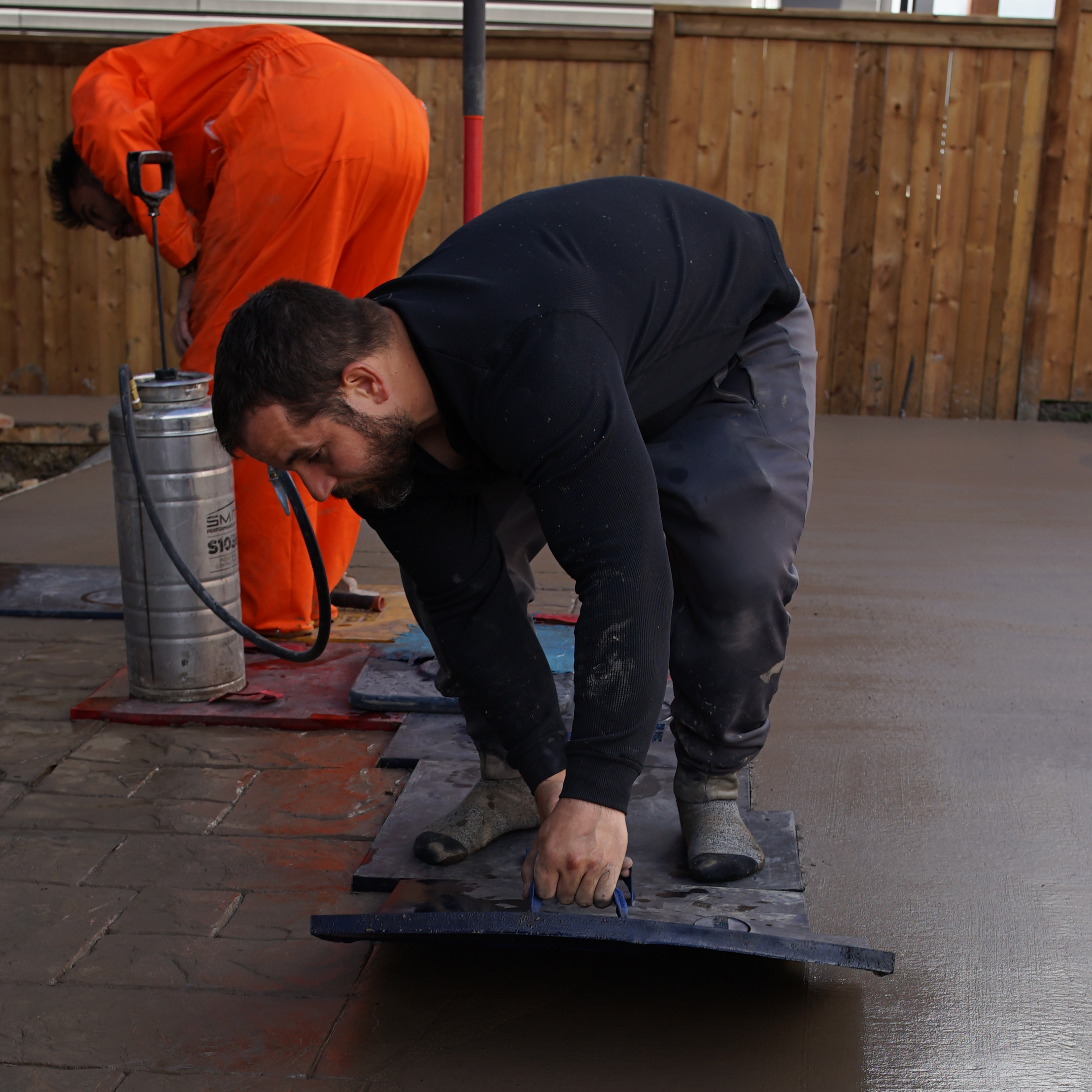 Jeff Rosko, founder of Rosko Concrete Inc., working on a stamped concrete project in Calgary
