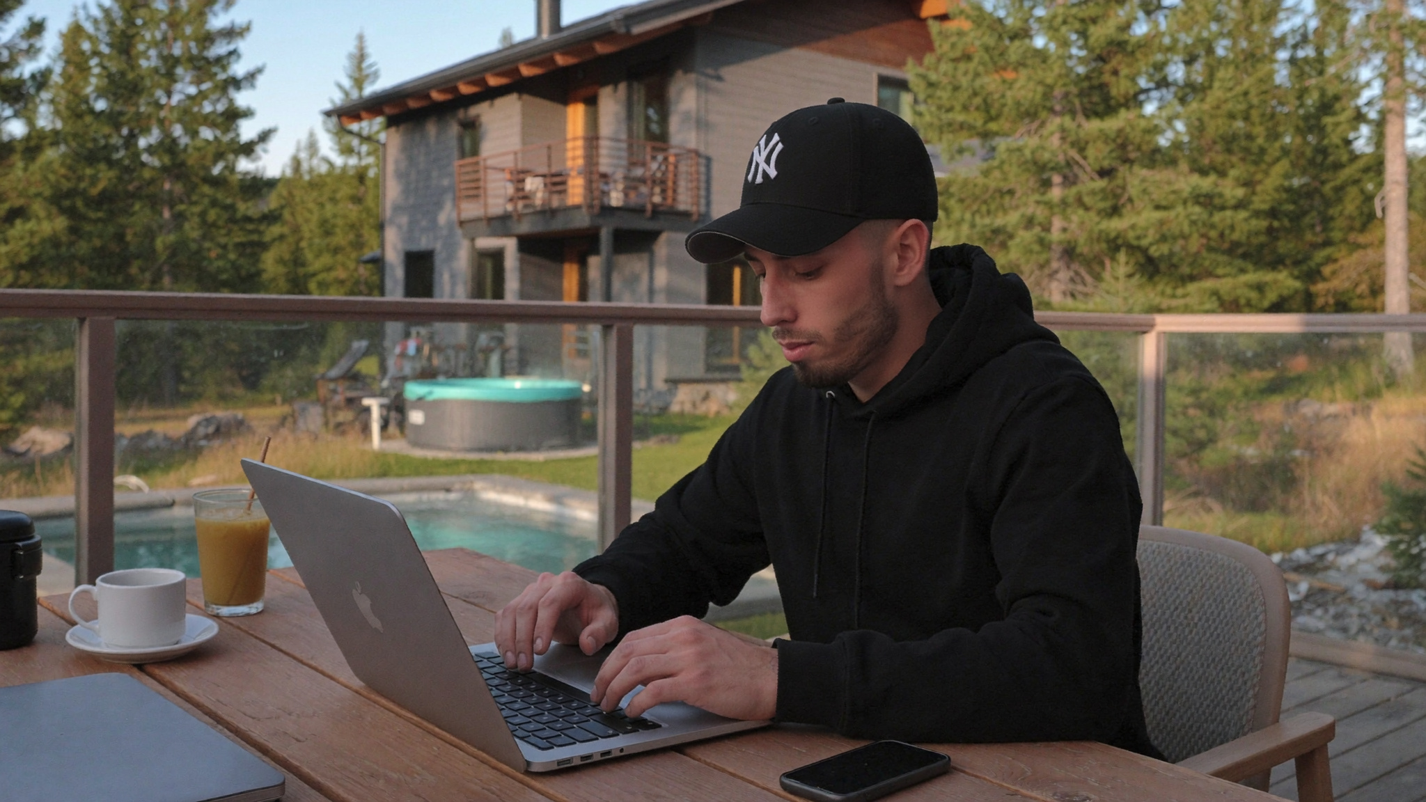 Airbnb co-host managing short-term rental listings from the deck of a mountain property