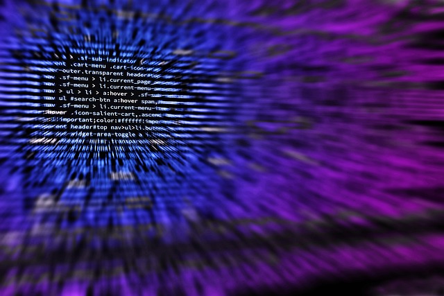 Code on a monitor in a darkened room