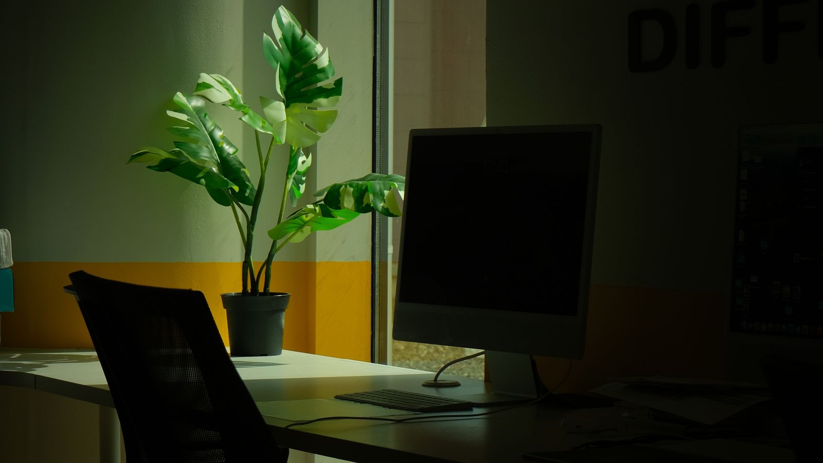 A quiet desk and monitor in low evening light, where the end of day account check happens