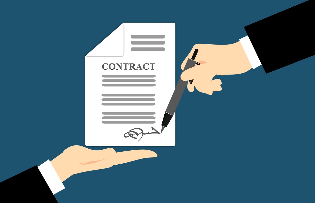 A printed agreement and pen on a desk, representing the font end user licence agreement most businesses never read